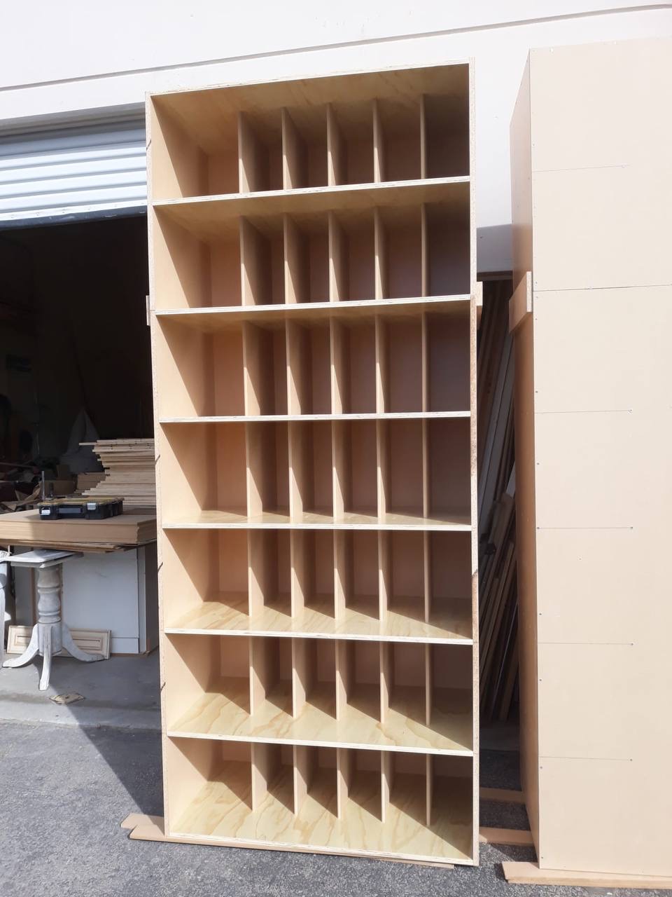 Tall plywood cubby shelving unit shop-built by JH Cabinetry in Glendale CA