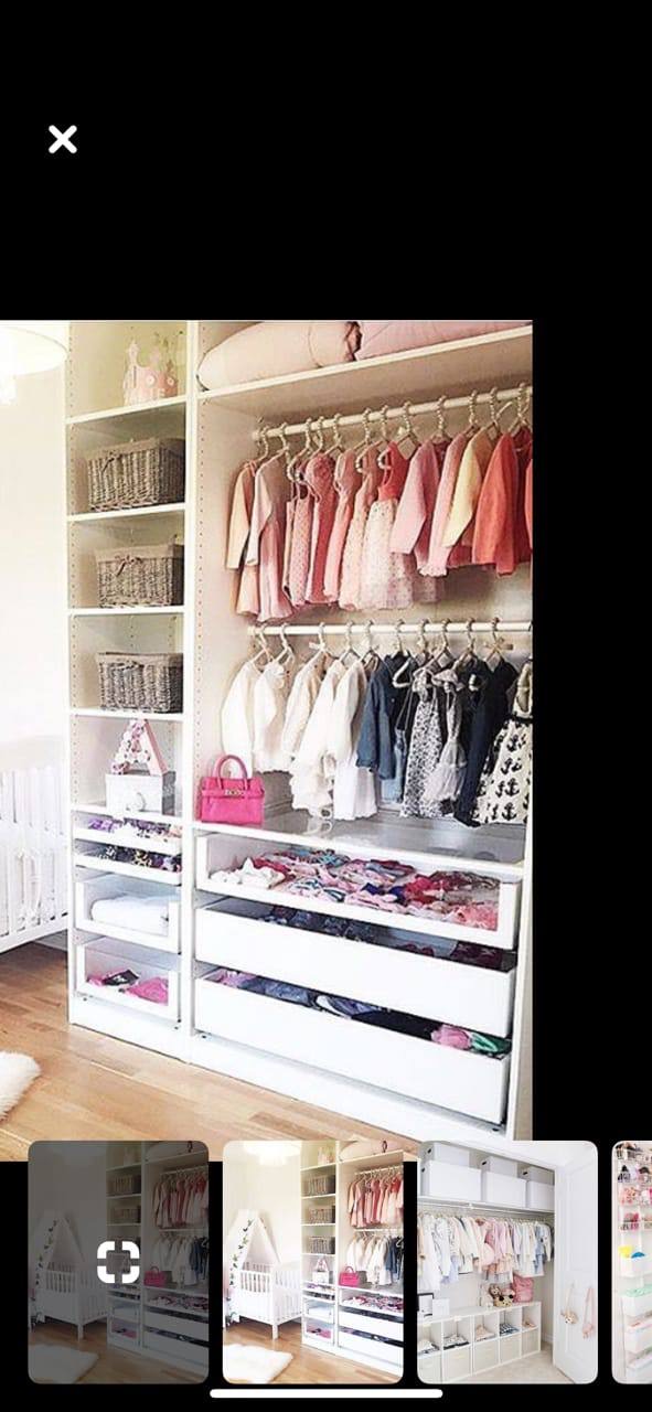 Custom white nursery closet with double hanging rods, baskets, and pull-out drawers built by JH Cabinetry in Glendale
